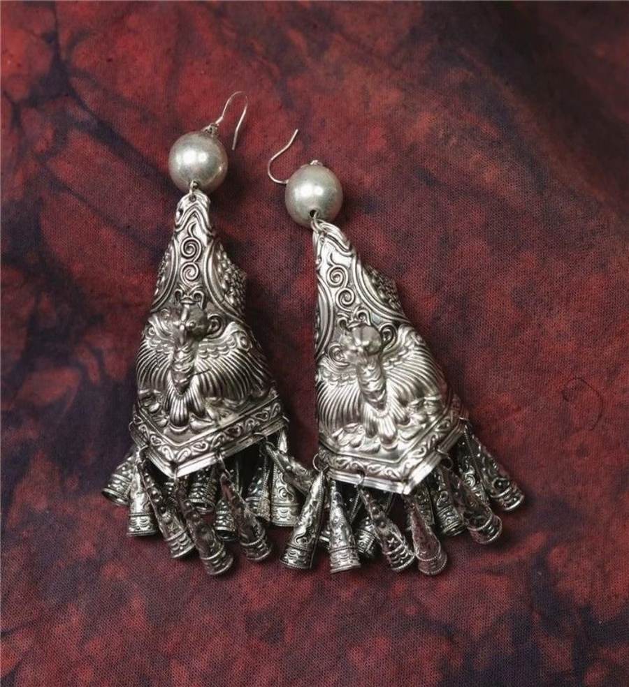 Silver earrings with bell tassels