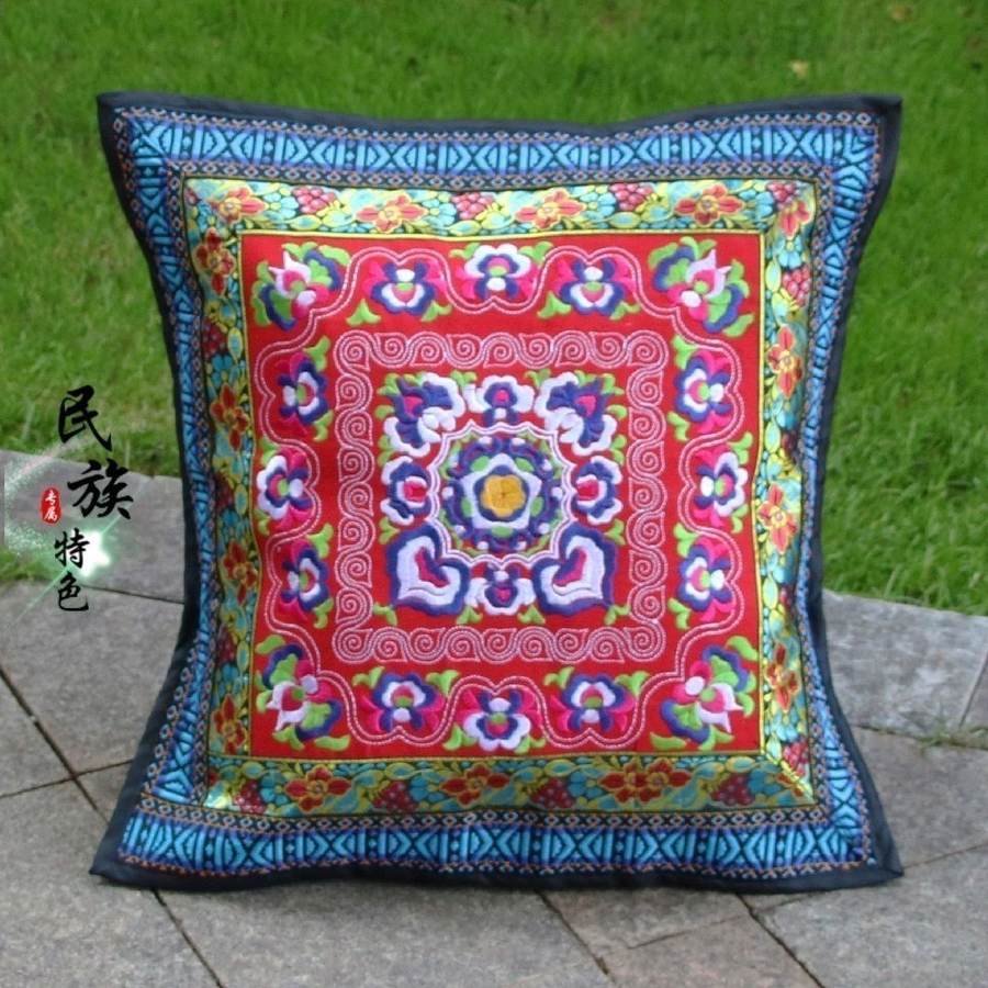 Square embroidered panel with a central floral medallion