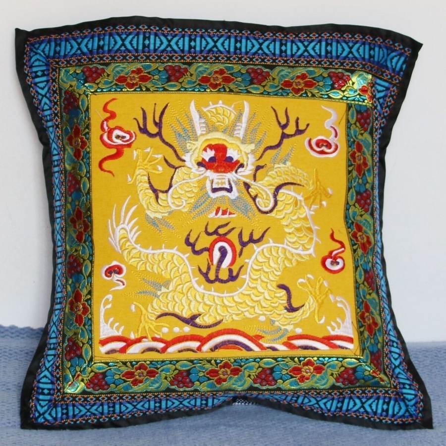 Embroidered yellow panel with a dragon medallion and blue border