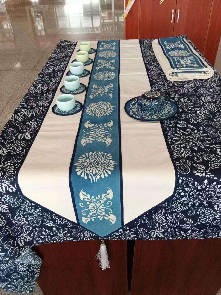 Indigo and white table runner with tea cups and coasters