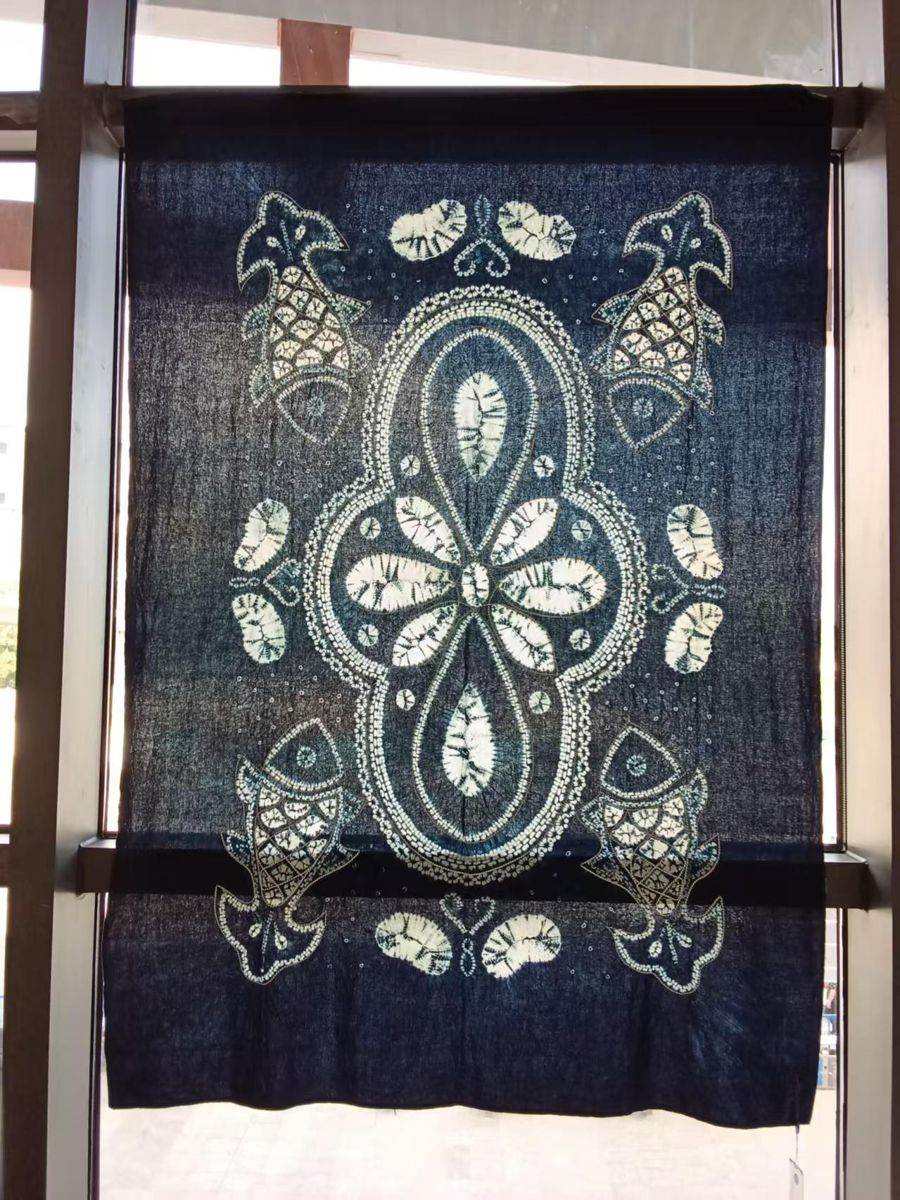 Indigo hanging cloth with a central white medallion