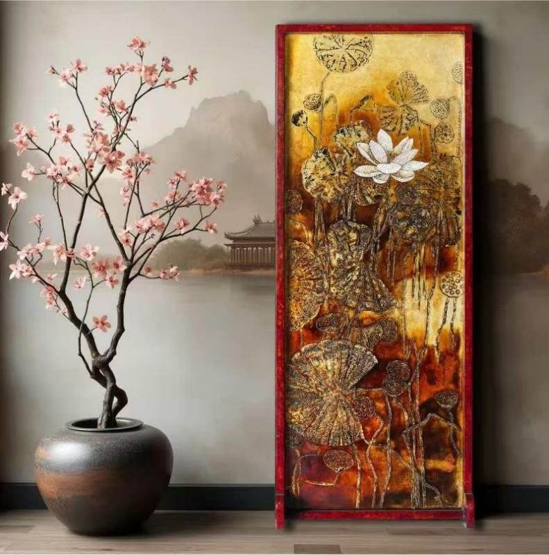 A tall lacquer panel with gold lotus leaves and a white flower on a red ground, beside a blossom branch